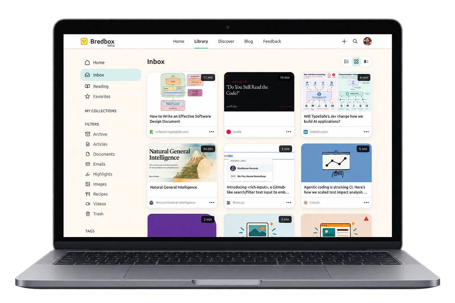 Bredbox open on a laptop, showing the inbox as a grid of saved articles with collections, filters, and tags in the sidebar